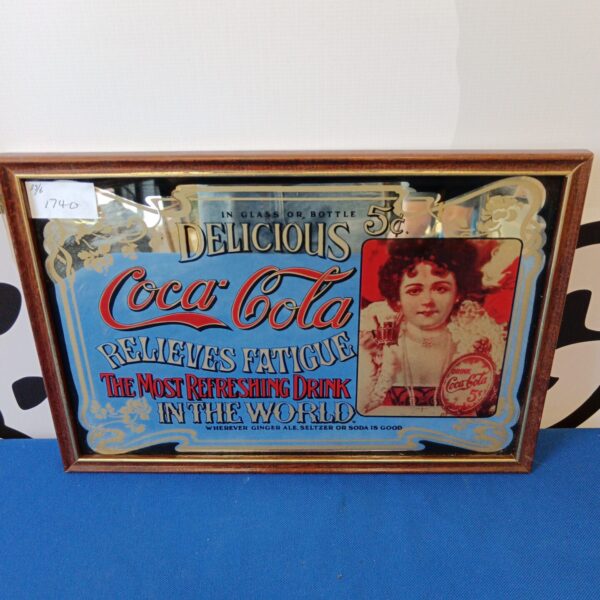 Vintage Coca-Cola mirror with "Delicious 5¢" advertising.