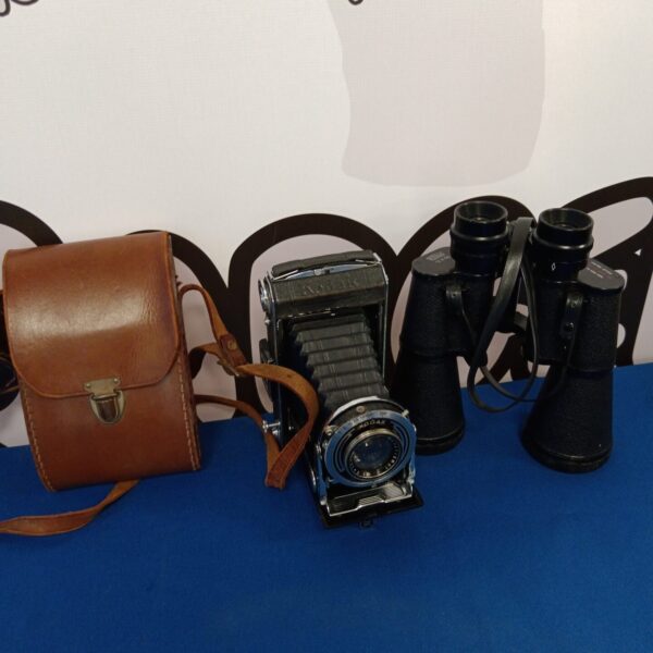 Vintage Kodak camera and Prinz binoculars in a lot.