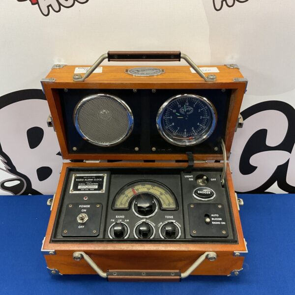 Vintage Spirit of Louis radio alarm clock with circular dial.