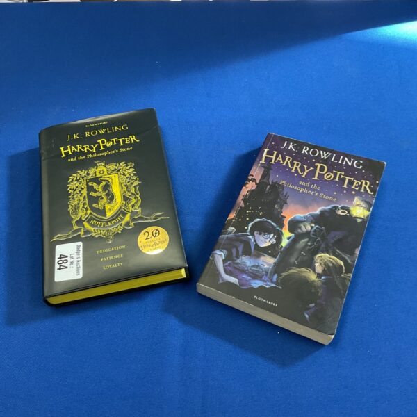 Two Harry Potter books, including 20th anniversary edition.