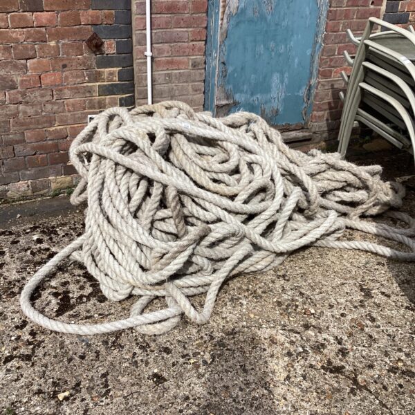 Close-up of a large coil of thick, natural fibre rope.