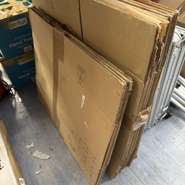Bundle of flat-packed cardboard boxes for moving or storage.