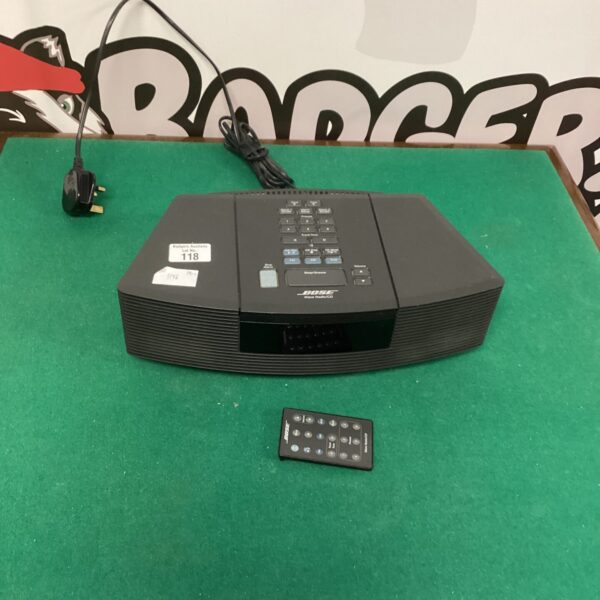 Vintage Bose Wave radio CD player with remote control.