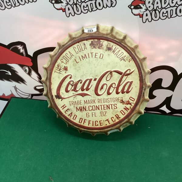 Vintage Canadian Coca Cola bottle top advertising sign.