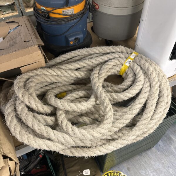 Thick coir rope coiled, ideal for garden and DIY projects.