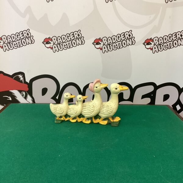 Vintage cast iron duck family doorstop for farmhouse decor.