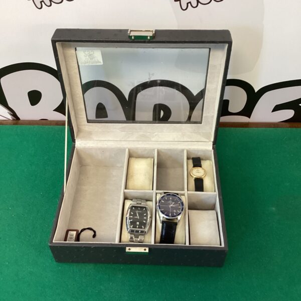 Vintage watch box with a timepiece inside, collector's item.