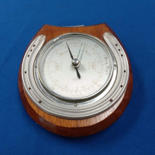 Vintage Shortland horseshoe barometer with dark wood housing.