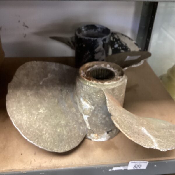 Vintage marine propeller blades showing wear and corrosion.