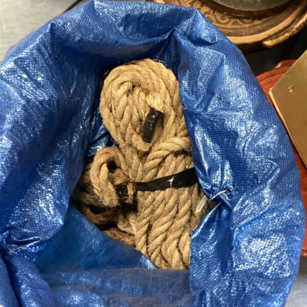 Sack full of various lengths of natural fibre rope.