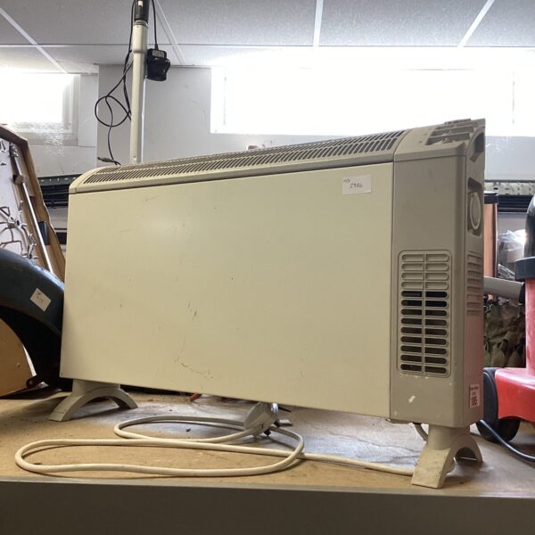 Vintage Dimplex electric heater in white plastic casing.