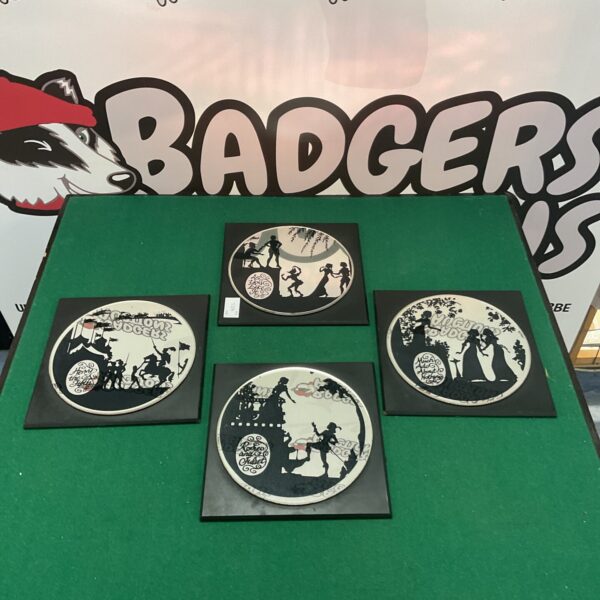 Set of four vintage Shakespeare mirrors with theatrical designs.