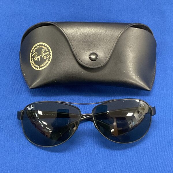 Vintage Ray Ban 8301 sunglasses with case, classic aviator style.