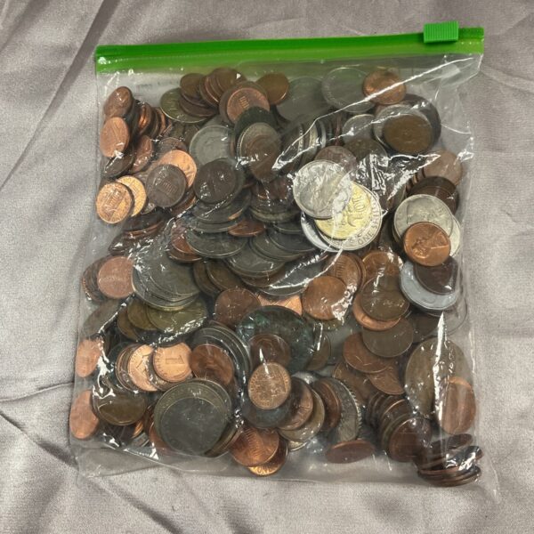 Bag of assorted coins for collectors and currency enthusiasts.