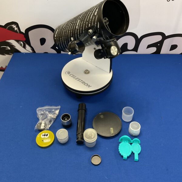 Vintage Celestron telescope on tripod for astronomy and star gazing.