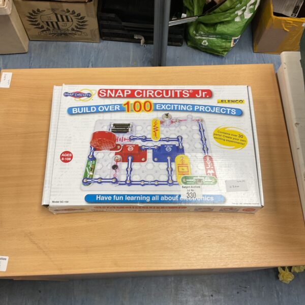 Elenco Snap Circuits Jr SC-100 kit with box showing over 100 projects.