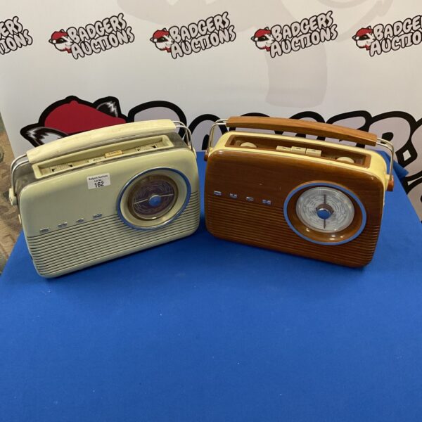 Pair of vintage retro FM radios on display.