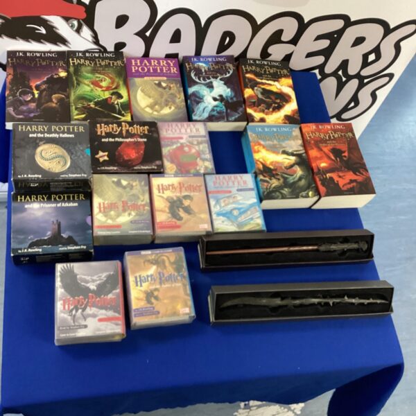 Harry Potter book collection with audio cassettes and wands.