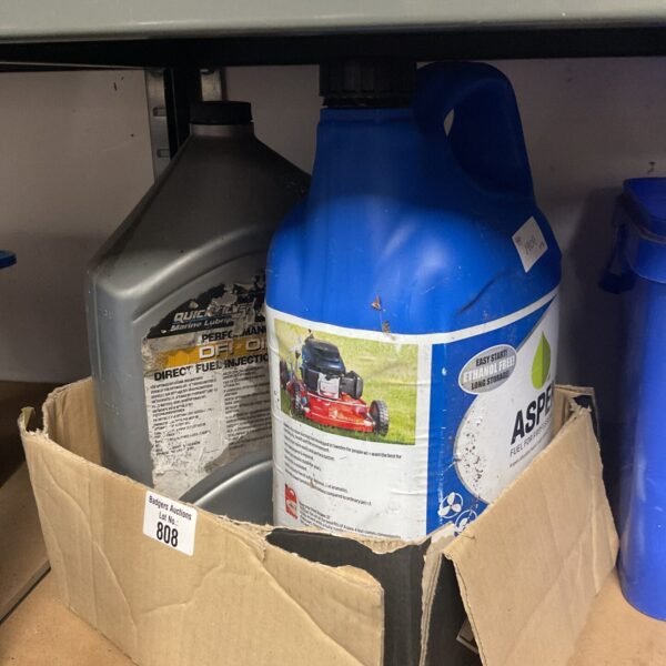 Partially full bottles of Aspen fuel and Quicksilver oil for small engines.