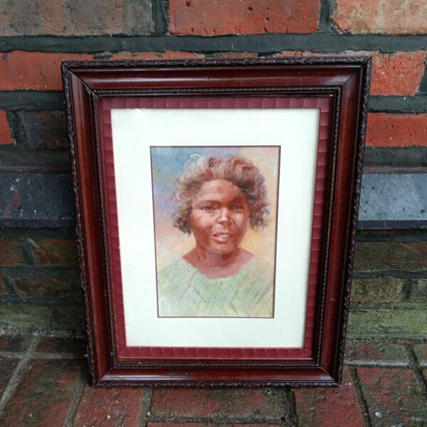 Vintage oil painting of an Aboriginal woman's portrait.