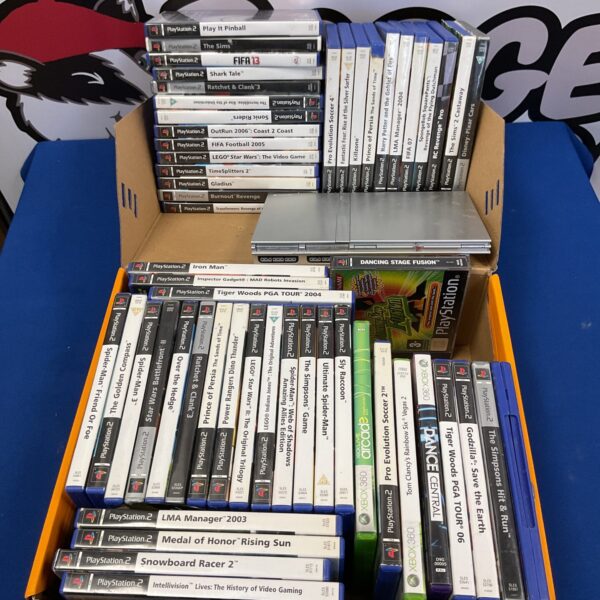 PlayStation 2 slim console bundle with games and controllers.