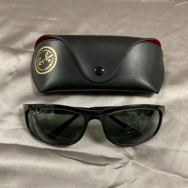 Vintage Ray Ban Bausch & Lomb sunglasses with black frames.