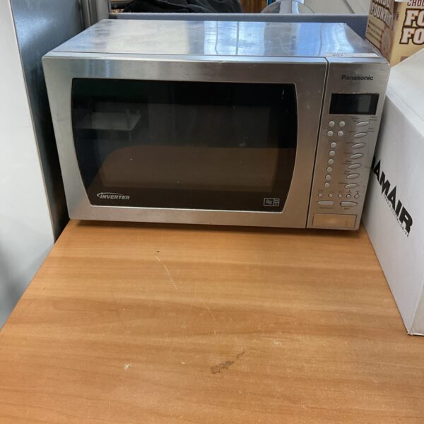 Stainless steel Panasonic microwave oven on a countertop.