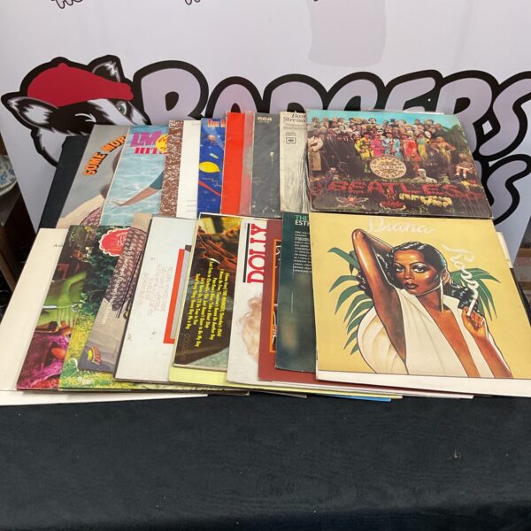 Vintage vinyl record collection featuring Beatles and Diana Ross records.