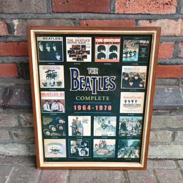Framed Beatles album cover print, vintage 1960s music poster.