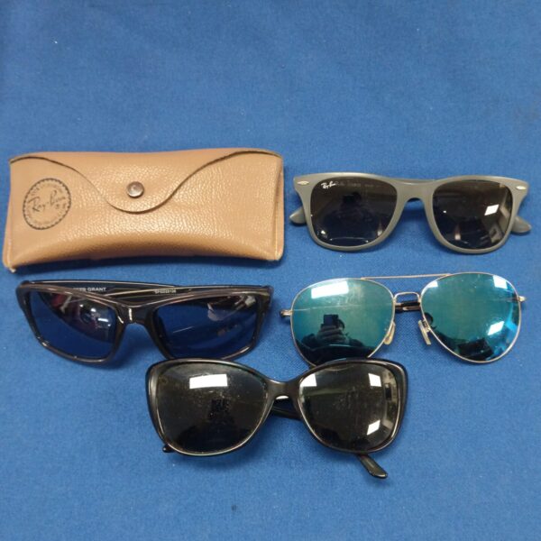 Vintage sunglasses lot featuring Ray-Ban aviators and other styles.