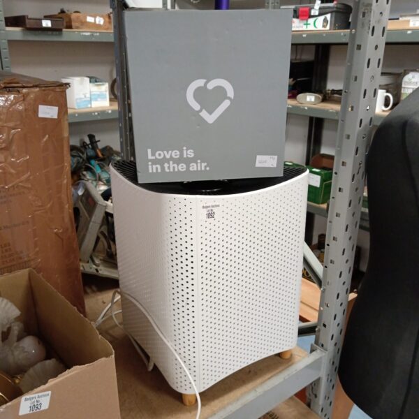 White air purifier with a new filter included for clean air.