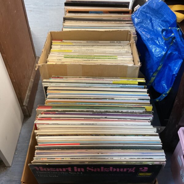 Lot of vintage classical vinyl records in cardboard boxes.
