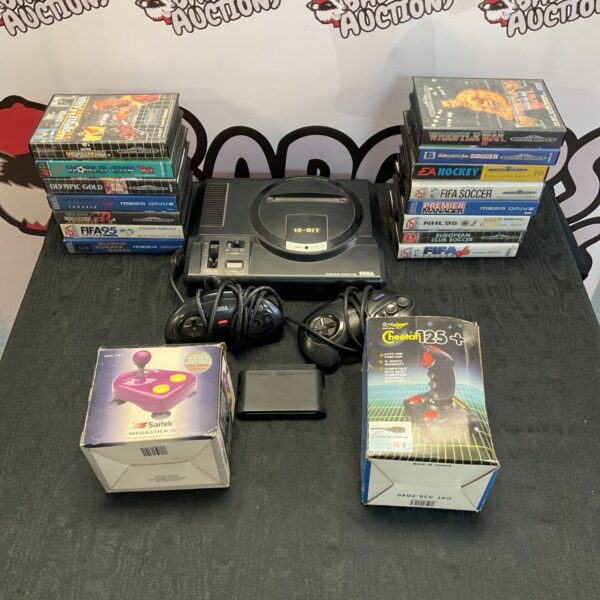 Sega Megadrive console bundle with boxed games and controllers.