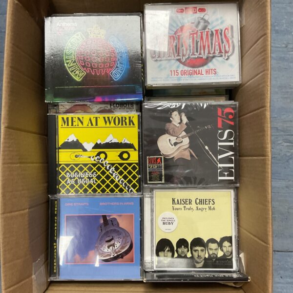 CD collection featuring Ministry of Sound, Men at Work, and Dire Straits albums.