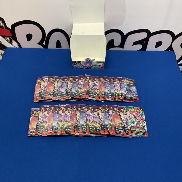 Opened Pokemon booster packs lot for collectors and trading card game fans.