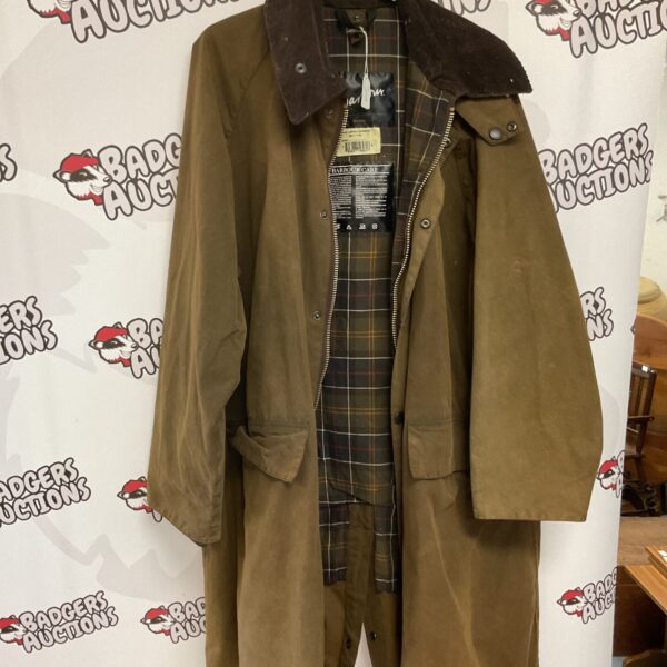 Front view of a classic Barbour Burghley trench coat in waxed cotton.
