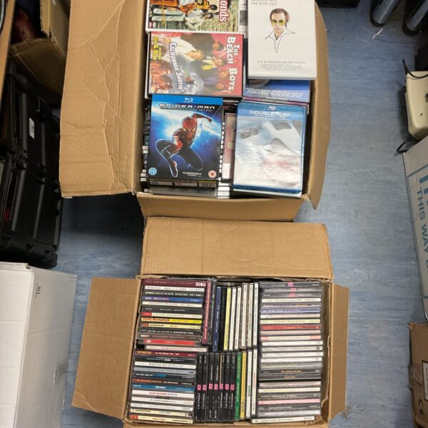 Large box set of CDs and DVDs for music and film fans.