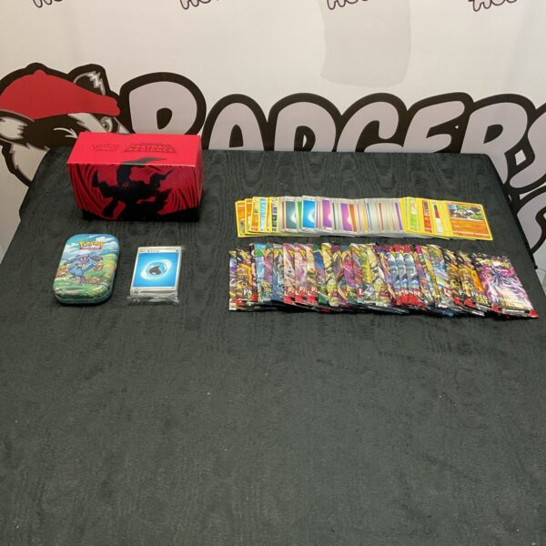Pokemon card collection with opened booster packs and a tin.