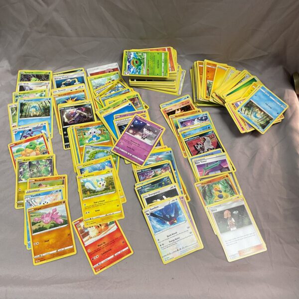 Large lot of Pokemon trading cards for collectors.