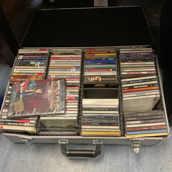 Vintage aluminium case filled with a large CD collection.