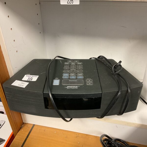 Vintage Bose Wave Radio CD Player tabletop audio system.