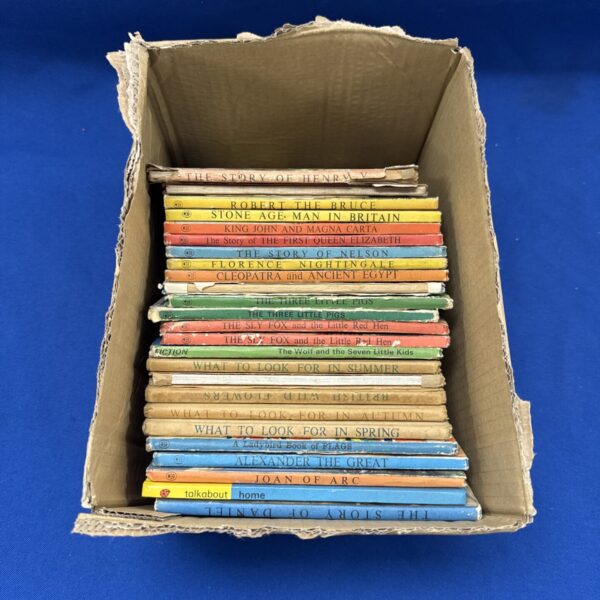 Lot of vintage Penguin books with colourful covers.