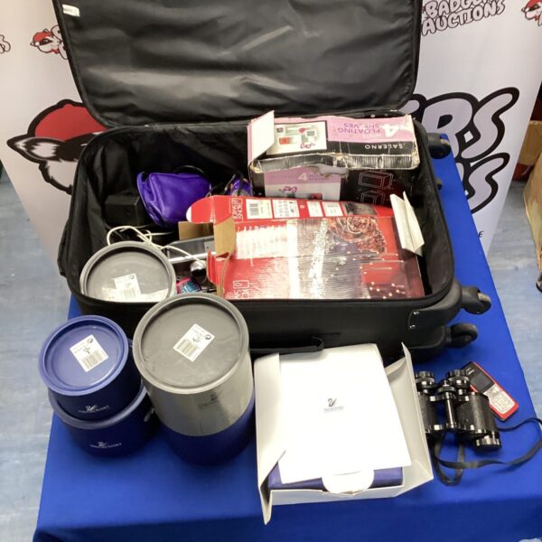 Vintage suitcase containing Swarovski boxes and Prinz binoculars.