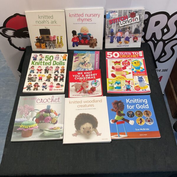 Collection of vintage and modern knitting books for crafting.