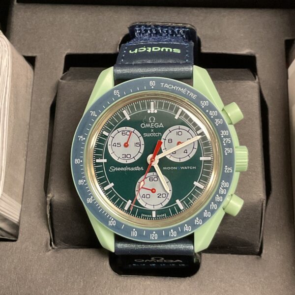 Blue Omega Swatch Moonwatch ‘Mission on Earth’ front view.