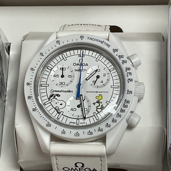 White Omega Swatch Moonphase watch with moonphase dial.