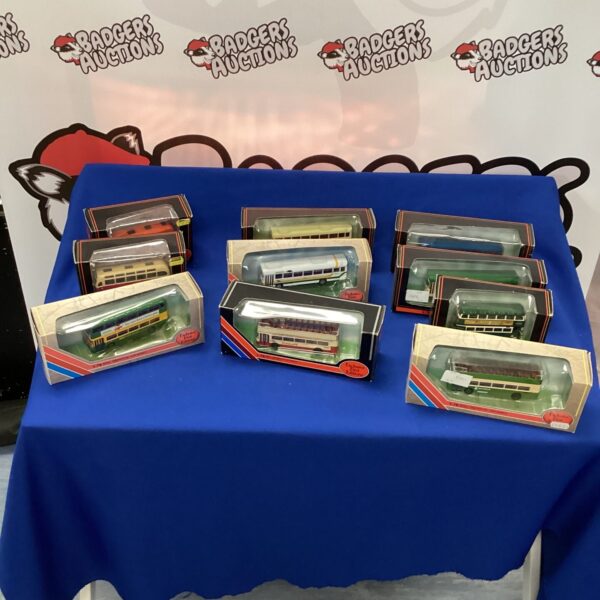 Lot of ten first edition die cast model buses for collectors.