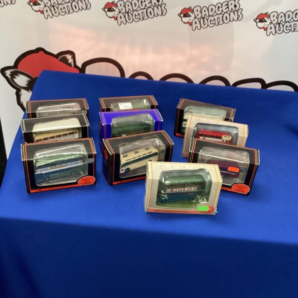 Selection of vintage model buses in their original boxes.