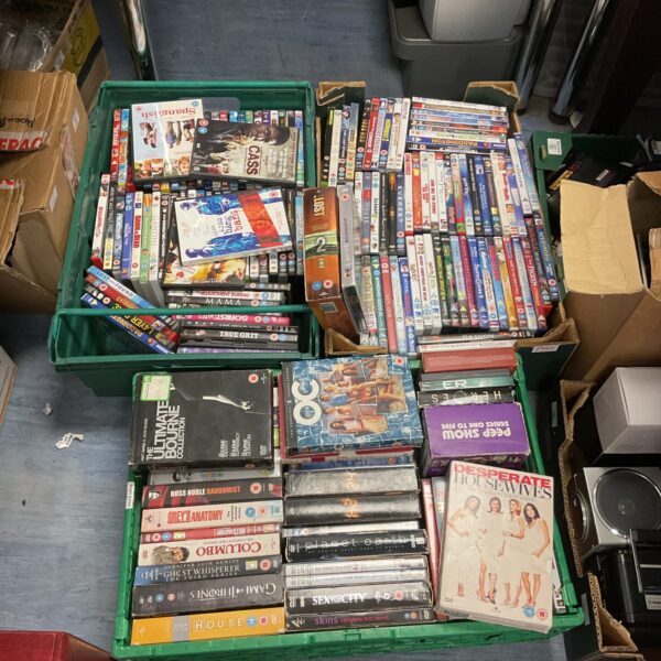 Large lot of DVDs and box sets for home entertainment.