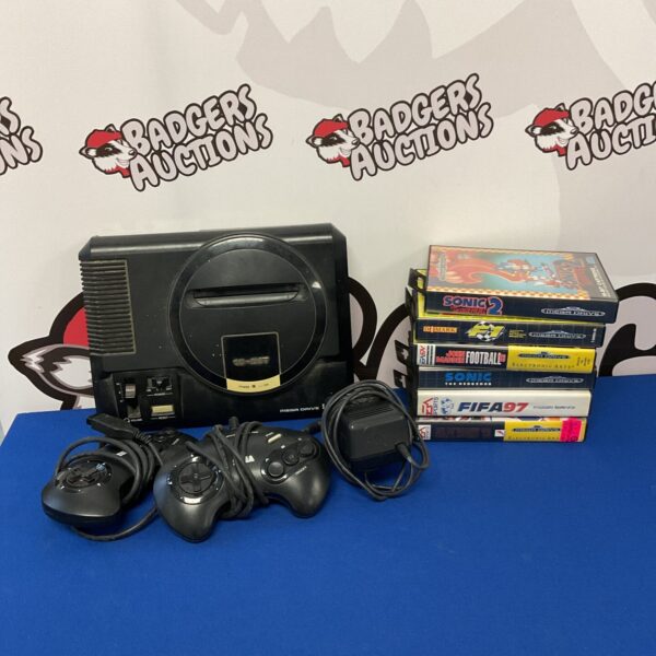 Sega Megadrive console with Sonic the Hedgehog game and controller.